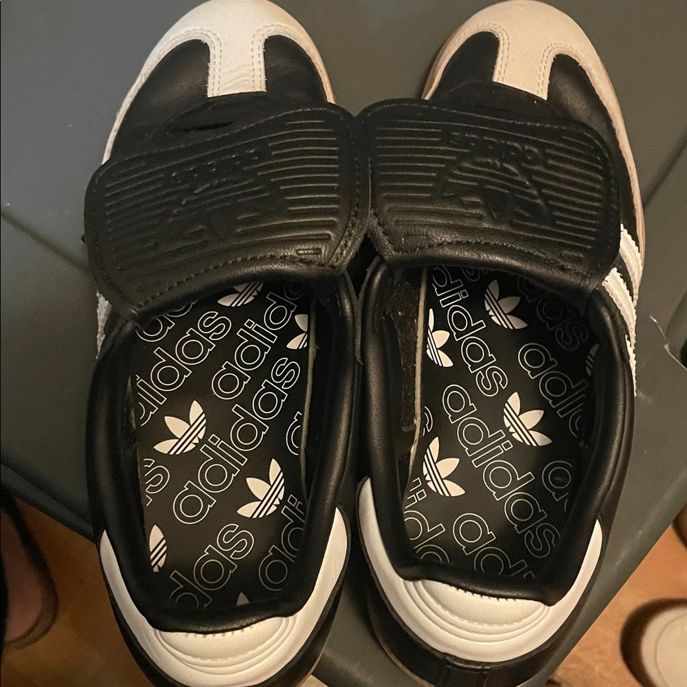 Adidas Black and White sambas with long tong